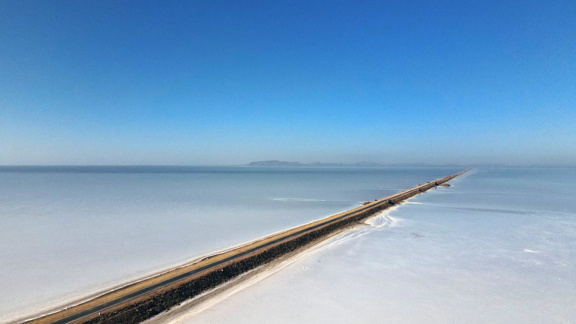 Scenic straight Road to Heaven highway in White Rann of Kutch